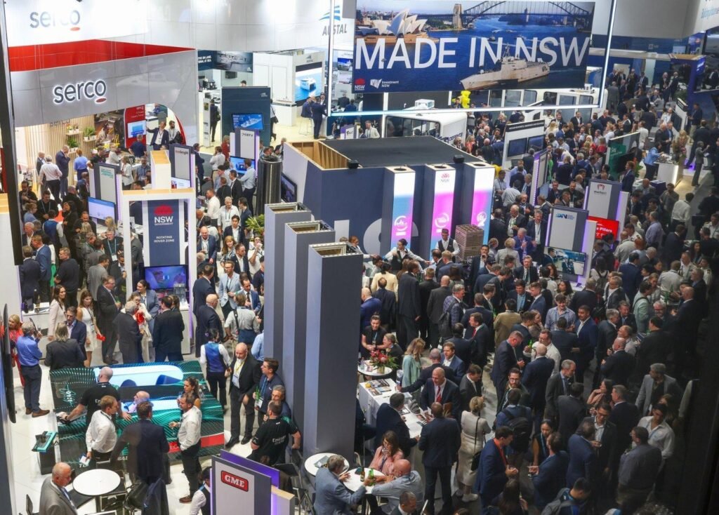 Exhibition stand builders in Sydney presenting modular exhibition booths and branded trade show displays at a business exhibition.